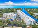 Aerial view of waterfront condos, showcasing prime location and canal access at 1709 N Tamiami Trl # 403, Sarasota, FL 34234