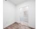 A clean and bright walk-in closet with wood-look flooring and fresh paint at 1709 N Tamiami Trl # 403, Sarasota, FL 34234