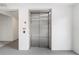 Building elevator with neutral decor and access buttons on the side wall at 1709 N Tamiami Trl # 403, Sarasota, FL 34234
