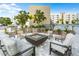 Outdoor fire pit with seating, perfect for entertaining at this condo complex at 1709 N Tamiami Trl # 403, Sarasota, FL 34234