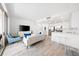Bright, modern living area with an open kitchen, stainless steel appliances and sleek bar seating at 1709 N Tamiami Trl # 403, Sarasota, FL 34234