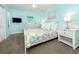 Bedroom with a king-size bed, light walls, and carpeted floors at 6157 Midnight Pass Rd # C11, Sarasota, FL 34242