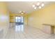 Bright living room with tiled floors and sliding glass doors at 25275 Rampart Blvd # 303, Punta Gorda, FL 33983