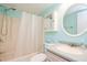 Clean bathroom with shower/tub combo, vanity, and linen closet at 25275 Rampart Blvd # 303, Punta Gorda, FL 33983