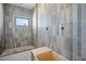 New bathroom under construction featuring vertical grey and blue tiles at 3621 San Remo Ter, Sarasota, FL 34239