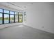 An empty room with large windows overlooking a canal is under construction at 3621 San Remo Ter, Sarasota, FL 34239