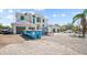 Stately two-story home with a three-car garage on a sunny day at 3621 San Remo Ter, Sarasota, FL 34239