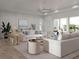 Bright and airy living room with stylish white sofas and coastal decor at 3621 San Remo Ter, Sarasota, FL 34239