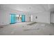 Bright living room with sliding glass doors offering scenic views of the water at 3621 San Remo Ter, Sarasota, FL 34239