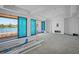 Spacious living room under construction featuring water views and an unfinished fireplace mantel at 3621 San Remo Ter, Sarasota, FL 34239