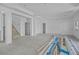 Large unfinished living space with high ceilings and access to a staircase, ready to be customized at 3621 San Remo Ter, Sarasota, FL 34239