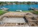 In-ground pool under construction overlooking the waterfront community and private boat docks at 3621 San Remo Ter, Sarasota, FL 34239