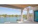 Picturesque view from the balcony showcases the waterfront community with boats and lush landscaping at 3621 San Remo Ter, Sarasota, FL 34239