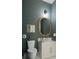 Stylish powder room with patterned wallpaper and a modern vanity at 3621 San Remo Ter, Sarasota, FL 34239