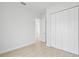 Spacious bedroom with large closet and access to another room at 23246 Stelling Ave, Port Charlotte, FL 33980