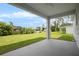 Covered patio overlooking a spacious backyard at 23246 Stelling Ave, Port Charlotte, FL 33980