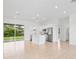 Open concept kitchen with island, stainless steel appliances, and tile flooring at 23246 Stelling Ave, Port Charlotte, FL 33980