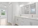 Modern bathroom with double vanity and tile flooring at 23246 Stelling Ave, Port Charlotte, FL 33980