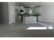 Modern kitchen with island and white cabinets at 5655 Hale Rd, Venice, FL 34293