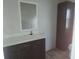 Bathroom with vanity, mirror, and linen storage at 4772 Duncan Rd, Punta Gorda, FL 33982