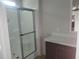 Bathroom with shower, vanity, and laminate floor at 4772 Duncan Rd, Punta Gorda, FL 33982