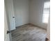 Small bedroom with closet and laminate floor at 4772 Duncan Rd, Punta Gorda, FL 33982