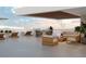 Spacious balcony with seating and ocean views at 223 Golden Gate Point # 9C, Sarasota, FL 34236
