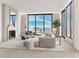 Spacious living room with city views and fireplace at 223 Golden Gate Point # 9C, Sarasota, FL 34236
