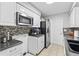 Modern kitchen featuring stainless steel appliances and ample cabinet space at 301 Lambert St, Port Charlotte, FL 33948