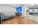 Cozy living room featuring modern flooring, a large TV, and sliding glass doors at 301 Lambert St, Port Charlotte, FL 33948