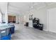 Enclosed porch with natural light and ceiling fans, ideal for relaxation or entertaining at 301 Lambert St, Port Charlotte, FL 33948
