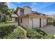 Charming townhome with a brick driveway, attached garage, and well-maintained landscaping at 1654 Starling Dr # 201, Sarasota, FL 34231