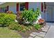 Landscaped walkway with flowers and shrubs at 4523 Independence Dr, Bradenton, FL 34210