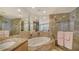 Spa-like bathroom with a large soaking tub and walk-in shower at 1300 Benjamin Franklin Dr # 701, Sarasota, FL 34236