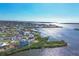 Wide aerial view of waterfront homes and community at 1910 Oregon Trl, Englewood, FL 34224