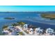 Aerial view of waterfront homes and neighborhood at 1910 Oregon Trl, Englewood, FL 34224