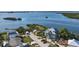 Aerial view of waterfront home and surrounding neighborhood at 1910 Oregon Trl, Englewood, FL 34224