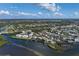 Wide aerial showcasing waterfront homes and community at 1910 Oregon Trl, Englewood, FL 34224