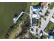 High-angle view of waterfront home and pool at 1910 Oregon Trl, Englewood, FL 34224