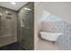 Spa-like bathroom with a large shower and a soaking tub at 1910 Oregon Trl, Englewood, FL 34224