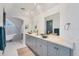 Bathroom boasts double vanities, a soaking tub, and modern design at 1910 Oregon Trl, Englewood, FL 34224