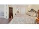 Spacious Primary bedroom with large bed and access to bathroom at 1910 Oregon Trl, Englewood, FL 34224