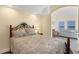 Bright bedroom with a comfortable bed and sitting area, offering lake views at 1910 Oregon Trl, Englewood, FL 34224