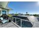 Screened-in pool and deck with water views at 1910 Oregon Trl, Englewood, FL 34224