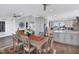 Spacious dining area with hardwood floors and kitchen access at 1910 Oregon Trl, Englewood, FL 34224