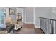 Elegant hallway with hardwood floors and access to bedrooms at 1910 Oregon Trl, Englewood, FL 34224