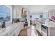 Modern kitchen with stainless steel appliances and marble countertops at 1910 Oregon Trl, Englewood, FL 34224
