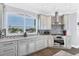 Modern kitchen with stainless steel appliances and marble countertops at 1910 Oregon Trl, Englewood, FL 34224