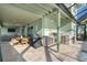 Outdoor kitchen and dining area with water views at 1910 Oregon Trl, Englewood, FL 34224