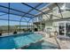 Relaxing screened pool overlooking the waterway at 1910 Oregon Trl, Englewood, FL 34224